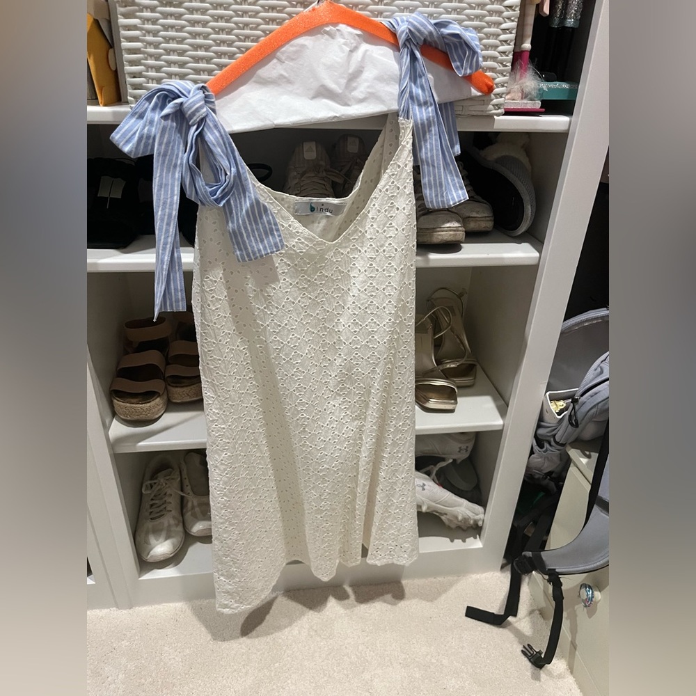White eyelet dress with blue and white striped bow straps